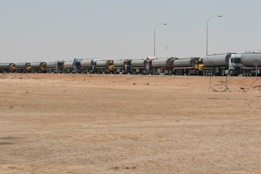 Tankers wait on the Jordanian side of the Iraq border for their American military escorts to arrive.
